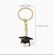 Personalized graduation keychain with red cap and diploma – perfect Canadian grad gift.